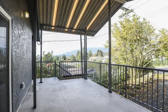 Covered sundeck with mountain and sunset views  