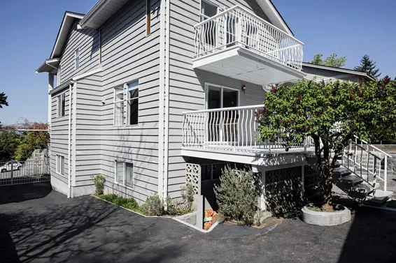Gated side driveway to a single car garage/sorkshop  